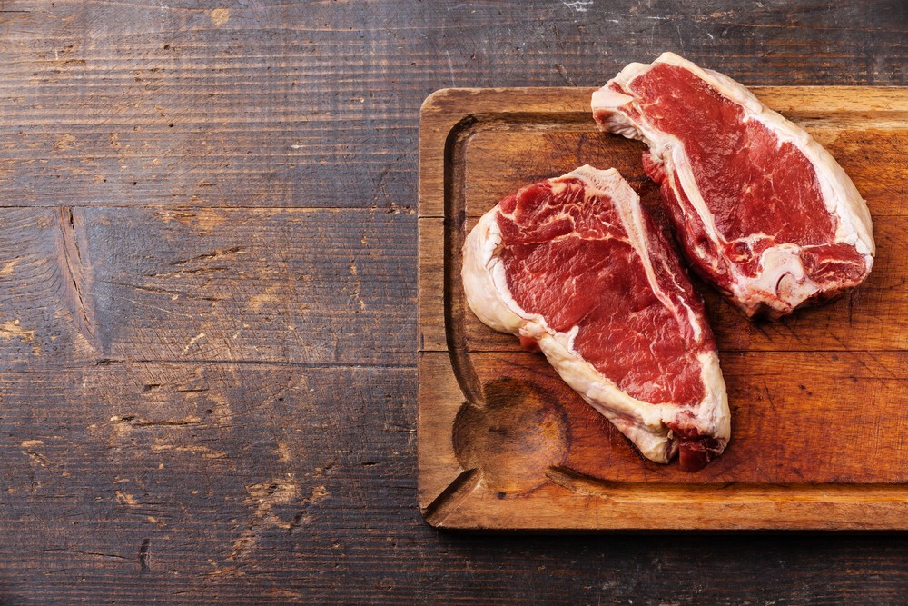 Why It Can Be Dangerous To Cut Meat On A Wooden Board